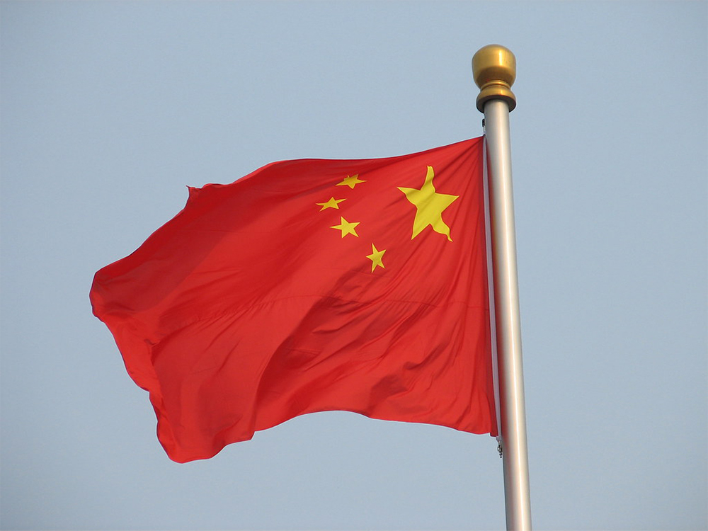 Flag of the People's Republic of China in Tiananmen square, Beijing (Flickr)